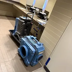 Drying equipment in a bathroom after a water leak