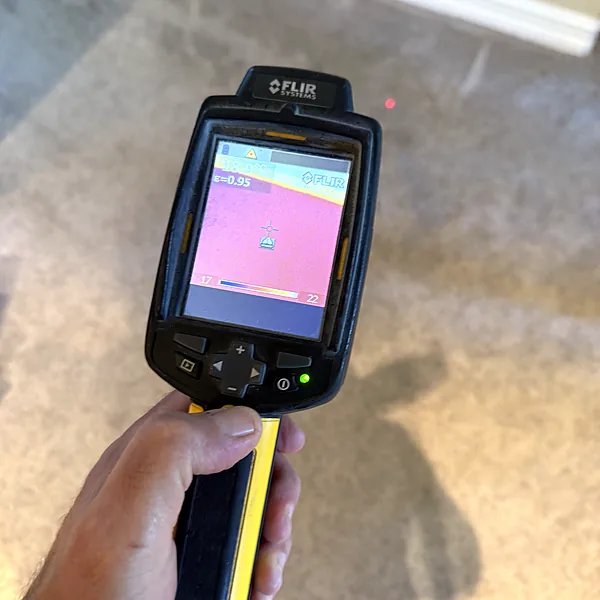Thermal camera scanning carpet for hidden moisture