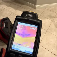 Thermal imaging camera showing hidden moisture under a tile floor