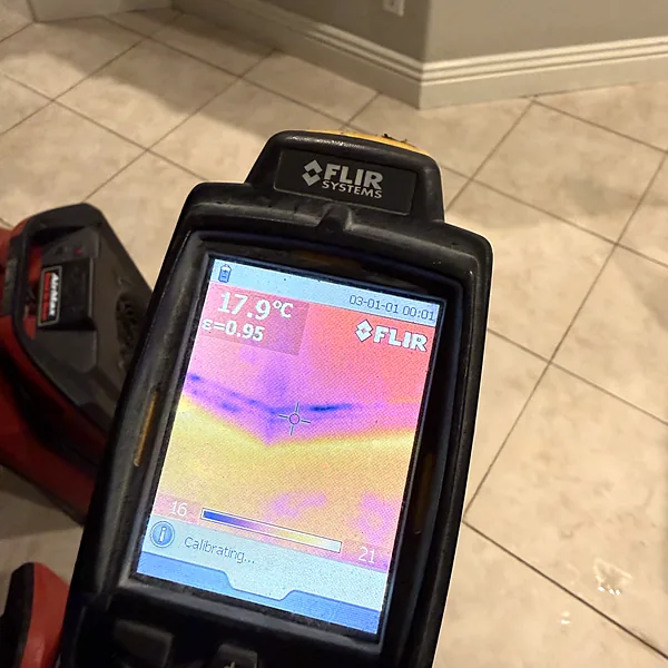 Thermal imaging camera showing hidden moisture under a tile floor